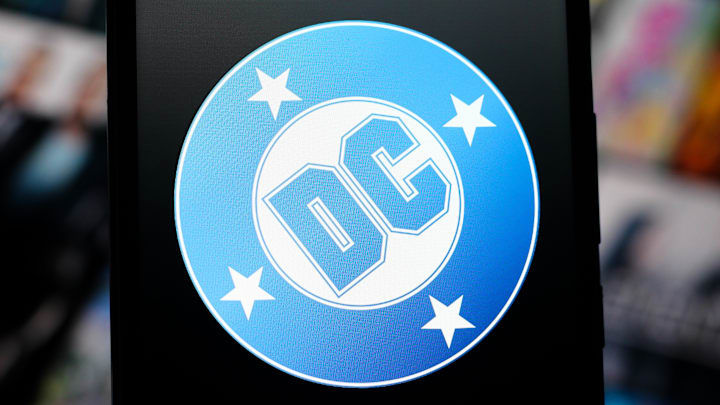 In this photo illustration, the DC Comics logo is seen...
