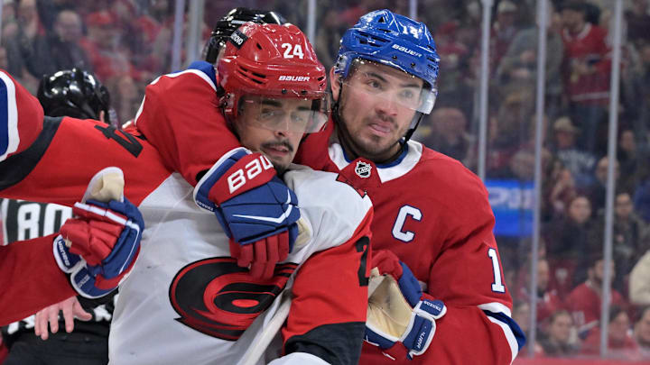 Mar 24, 2026; Montreal, Quebec, CAN; Montreal Canadiens forward Nick Suzuki (14) stops Carolina Hurricanes forward Seth Jarvis (24) from grabbing Montreal Canadiens defenseman Lane Hutson (48) during the second period at the Bell Centre. Mandatory Credit: Eric Bolte-Imagn Images Mar 24, 2026; Montreal, Quebec, CAN; Montreal Canadiens forward Nick Suzuki (14) stops Carolina Hurricanes forward Seth Jarvis (24) from grabbing Montreal Canadiens defenseman Lane Hutson (48) during the second period at the Bell Centre. Mandatory Credit: Eric Bolte-Imagn Images