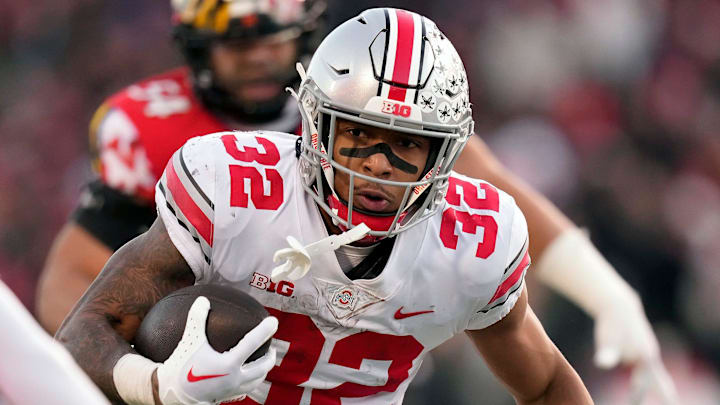 Nov 19, 2022; College Park, MD, USA; Ohio State Buckeyes running back TreVeyon Henderson (32) carries the ball against Maryland Terrapins in the second quarter of their Big Ten game at SECU Stadium. Nov 19, 2022; College Park, MD, USA; Ohio State Buckeyes running back TreVeyon Henderson (32) carries the ball against Maryland Terrapins in the second quarter of their Big Ten game at SECU Stadium.