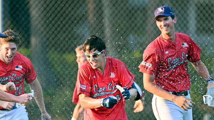 SOUTH YARMOUTH   07/06/23   The Y-D team celebrates with Dub Gleed  (center) after his hit that scored the walk off run in the 10th inning for a 4-3 victory over Bourne. Cape League baseball