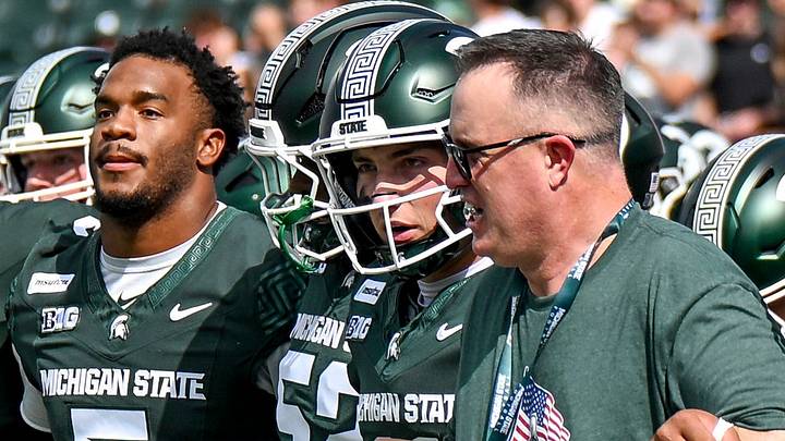 From left, Michigan State’s Jordan Hall, Alessio Milivojevic and head coach Pat Fitzgerald walk the end zone with the team before the football game against Eastern Michigan on Saturday, Sept. 12, 2026, at Spartan Stadium in East Lansing. From left, Michigan State’s Jordan Hall, Alessio Milivojevic and head coach Pat Fitzgerald walk the end zone with the team before the football game against Eastern Michigan on Saturday, Sept. 12, 2026, at Spartan Stadium in East Lansing.