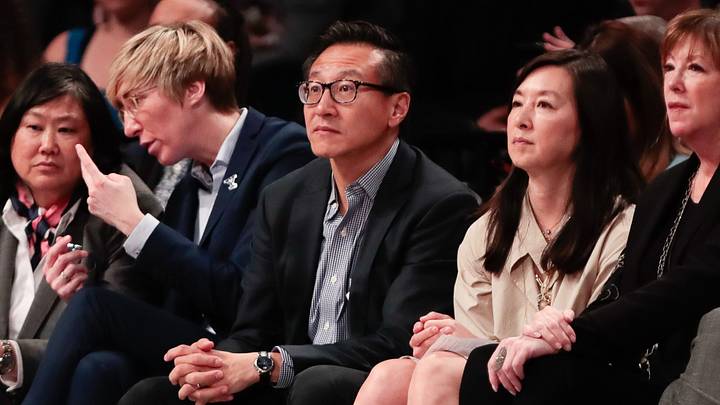 May 9, 2019; New York City, NY, USA; Taiwanese businessman Joe Tsai (center) looks on during the second half of the preseason WNBA game between the New York Liberty and the China National Team at Barclays Center.  Mandatory Credit: Vincent Carchietta-USA TODAY Sports