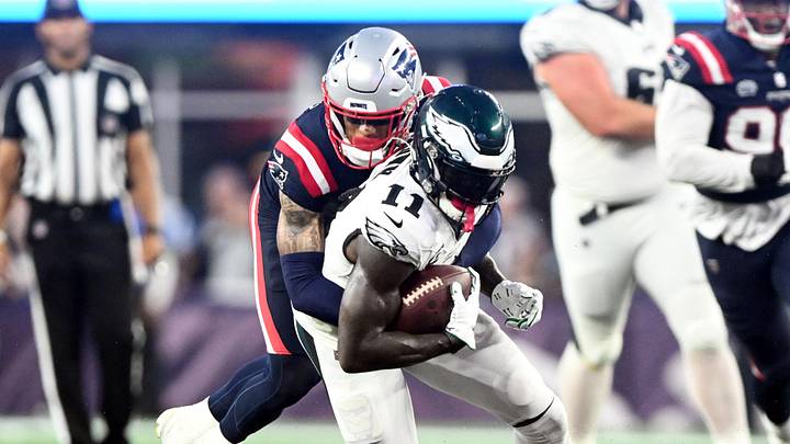 Sep 10, 2023; Foxborough, Massachusetts, USA; Philadelphia Eagles wide receiver A.J. Brown (11) is tackled by New England Patriots cornerback Christian Gonzalez (6) during the second half at Gillette Stadium. Mandatory Credit: Brian Fluharty-Imagn Images
