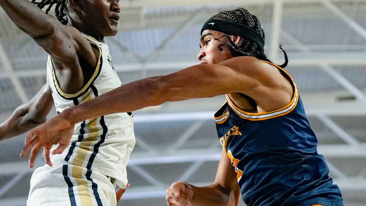Wheeler Wildcats guard Kevin Savage III (2) passes the ball.