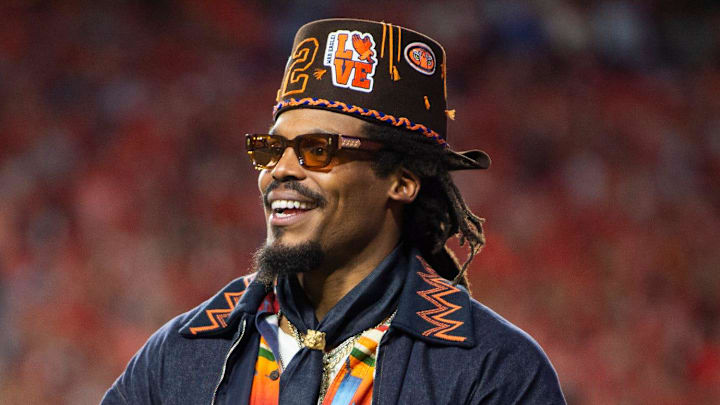 Former Auburn quarterback Cam Newton cheers on his team Former Auburn quarterback Cam Newton cheers on his team