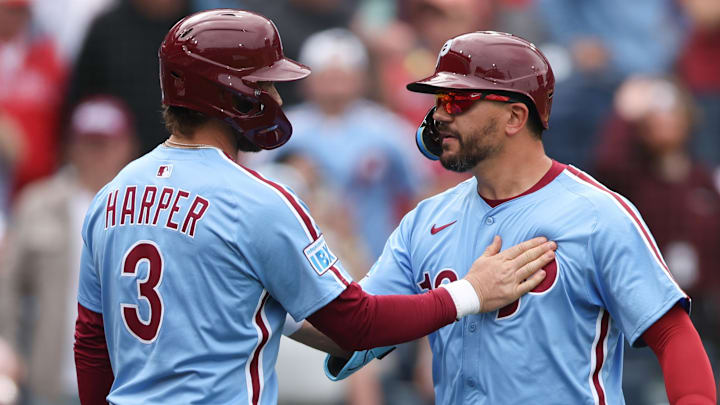 Apr 3, 2025; Philadelphia, Pennsylvania, USA; Philadelphia Phillies designated hitter Kyle Schwarber (12) celebrates his home run with first base Bryce Harper (3) during the seventh inning against the Colorado Rockies at Citizens Bank Park
