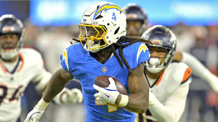 Dec 19, 2024; Inglewood, California, USA; Los Angeles Chargers running back Gus Edwards (4) runs for a touchdown in the second half against the Denver Broncos at SoFi Stadium. Mandatory Credit: Jayne Kamin-Oncea-Imagn Images Dec 19, 2024; Inglewood, California, USA; Los Angeles Chargers running back Gus Edwards (4) runs for a touchdown in the second half against the Denver Broncos at SoFi Stadium. Mandatory Credit: Jayne Kamin-Oncea-Imagn Images