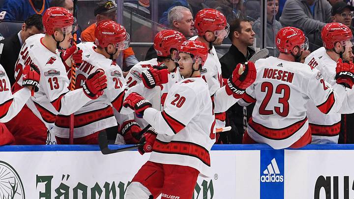 Apr 23, 2023; Elmont, New York, USA; Carolina Hurricanes center Sebastian Aho (20) celebrates his goal against the New York Islanders with the Carolina Hurricanes bench during the second period in game four of the first round of the 2023 Stanley Cup Playoffs at UBS Arena. Mandatory Credit: Dennis Schneidler-USA TODAY Sports