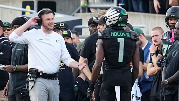 Oct 12, 2024; Eugene, Oregon, USA; Oregon Ducks head coach Dan Lanning talks to wide receiver Traeshon Holden (1) after he was penalized for spitting during the first half of the NCAA football game against the Ohio State Buckeyes at Autzen Stadium.