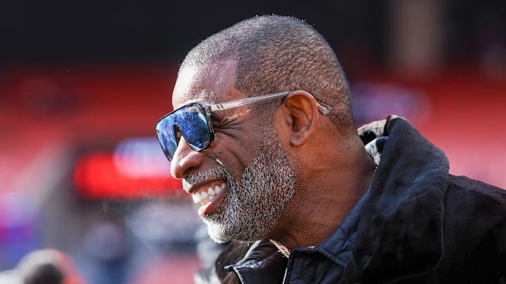 Dec 21, 2025; Cleveland, Ohio, USA;  Legendary  football and baseball player and father of Cleveland Browns quarterback Shedeur Sanders, Deion Sanders on the sidelines prior to a game against the Buffalo Bills at Huntington Bank Field. 