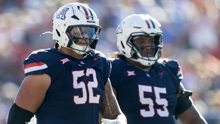 Nov 8, 2025; Tucson, Arizona, USA; Arizona Wildcats offensive lineman Ka'ena Decambra (52) and Chubba Maae (55) against the Kansas Jayhawks at Arizona Stadium. Mandatory Credit: Mark J. Rebilas-Imagn Images