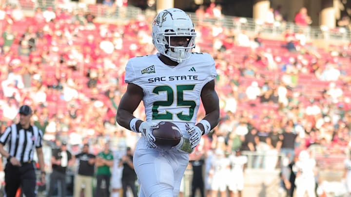 Sep 16, 2023; Stanford, California, USA; Sacramento State Hornets running back Elijah Tau-Tolliver (25) scores a touchdown during the second quarter against the Stanford Cardinal at Stanford Stadium. Mandatory Credit: Sergio Estrada-Imagn Images