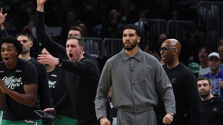May 2, 2026; Boston, Massachusetts, USA; Boston Celtics forward Jayson Tatum (0) and the rest of the Celtics bench react to a three point basket against the Philadelphia 76ers during the second quarter of game seven of the first round of the 2026 NBA Playoffs at TD Garden. 