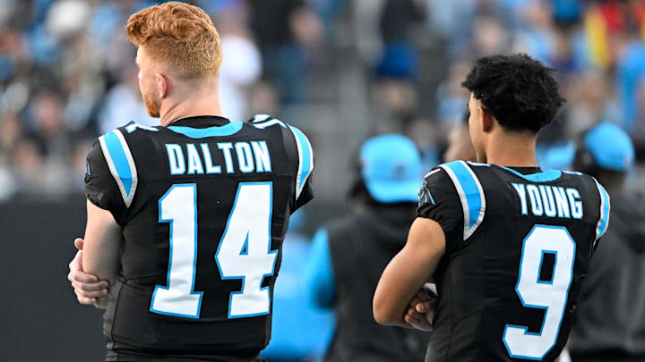 Nov 3, 2024; Charlotte, North Carolina, USA; Carolina Panthers quarterback Andy Dalton (14) and quarterback Bryce Young (9) on the sidelines in the fourth qarter at Bank of America Stadium. Mandatory Credit: Bob Donnan-Imagn Images