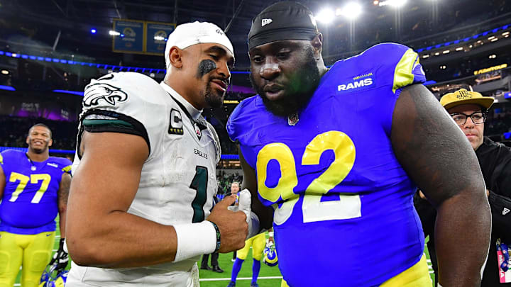 Nov 24, 2024; Inglewood, California, USA; Philadelphia Eagles quarterback Jalen Hurts (1) meets with Los Angeles Rams defensive tackle Neville Gallimore (92) at SoFi Stadium. Mandatory Credit: Gary A. Vasquez-Imagn Images Nov 24, 2024; Inglewood, California, USA; Philadelphia Eagles quarterback Jalen Hurts (1) meets with Los Angeles Rams defensive tackle Neville Gallimore (92) at SoFi Stadium. Mandatory Credit: Gary A. Vasquez-Imagn Images