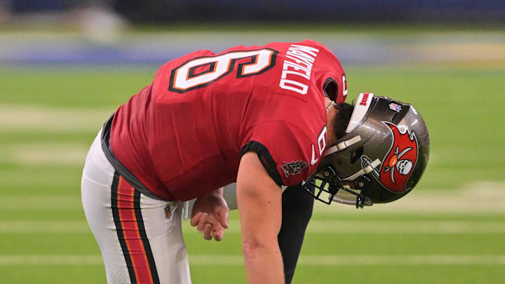 Tampa Bay Buccaneers quarterback Baker Mayfield (6) kneels on the field with an apparent injury against the Los Angeles Rams 