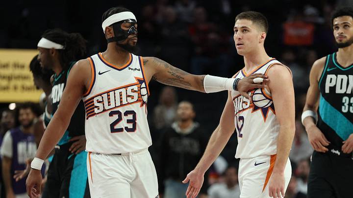 Feb 3, 2026; Portland, Oregon, USA;  Phoenix Suns guard Jordan Goodwin (23) recognizes teammate guard Collin Gillespie (12) during the second half against the Portland Trail Blazers at Moda Center. Mandatory Credit: Jaime Valdez-Imagn Images