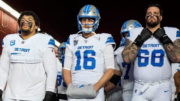 From left, Detroit Lions offensive tackle Penei Sewell (58), quarterback Jared Goff (16) and Taylor Decker (68)