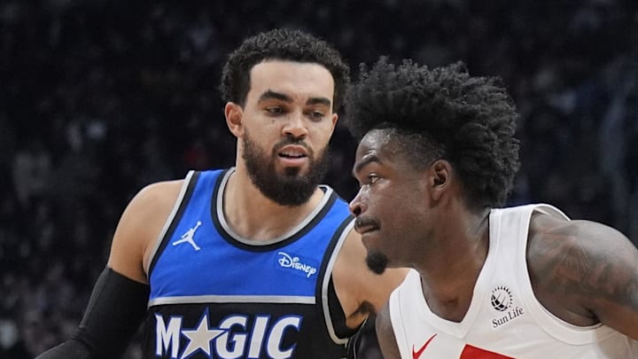 Toronto Raptors guard Jamal Shead drives to the net against Orlando Magic guard Tyus Jones. Toronto Raptors guard Jamal Shead drives to the net against Orlando Magic guard Tyus Jones.