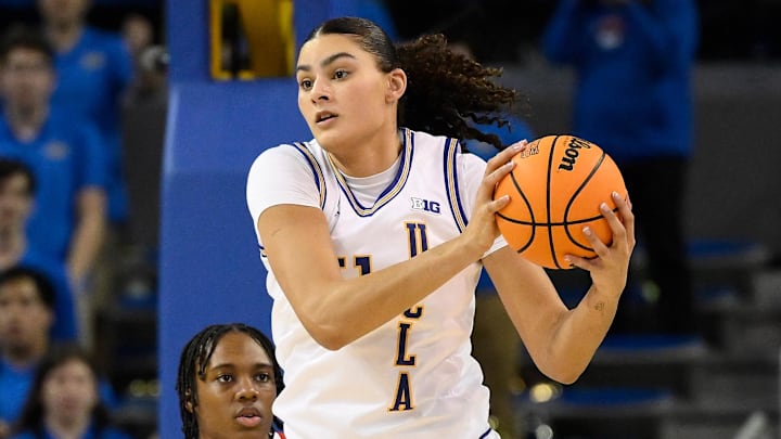 Feb 5, 2025; Los Angeles, California, USA; UCLA Bruins center Lauren Betts (51) and Ohio State Buckeyes forward Ajae Petty (1) during an NCAA basketball game at Pauley Pavilion presented by Wescom. Mandatory Credit: Robert Hanashiro-Imagn Images