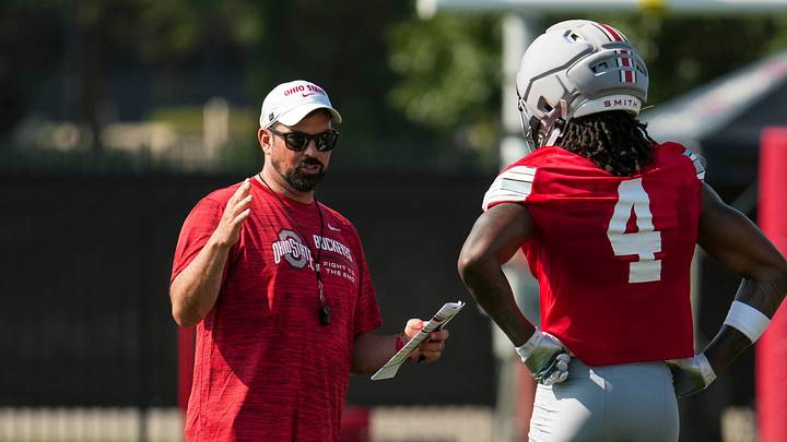 Ohio State Buckeyes head coach Ryan Day talks to wide receiver Jeremiah Smith (4) during the first practice of training camp at the Woody Hayes Athletic Center on Aug. 6, 2026. Ohio State Buckeyes head coach Ryan Day talks to wide receiver Jeremiah Smith (4) during the first practice of training camp at the Woody Hayes Athletic Center on Aug. 6, 2026.