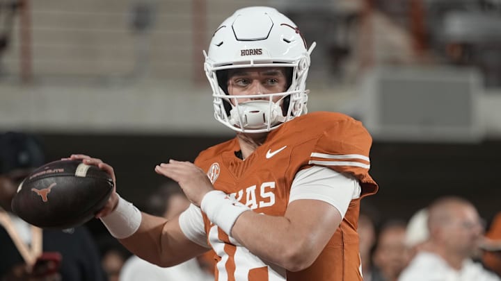 Nov 28, 2025; Austin, Texas, USA; Texas Longhorns quarterback Arch Manning warms up before a game against the Texas A&M Aggies at Darrell K Royal-Texas Memorial Stadium. Mandatory Credit: Scott Wachter-Imagn Images