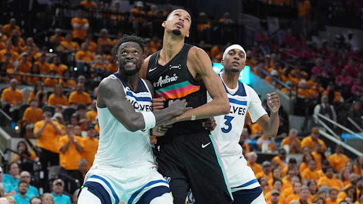 May 4, 2026; San Antonio, Texas, USA; Minnesota Timberwolves forwards Julius Randle (30) and Jaden McDaniels (3) try to keep San Antonio Spurs forward Victor Wembanyama (1) back in the second half during game one of the second round of the 2026 NBA Playoffs at Frost Bank Center. May 4, 2026; San Antonio, Texas, USA; Minnesota Timberwolves forwards Julius Randle (30) and Jaden McDaniels (3) try to keep San Antonio Spurs forward Victor Wembanyama (1) back in the second half during game one of the second round of the 2026 NBA Playoffs at Frost Bank Center.