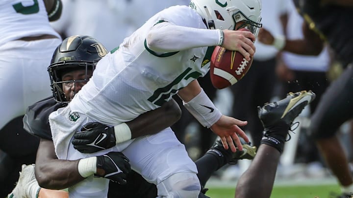 Baylor Bears quarterback Blake Shapen (12) is sacked by UCF Knights defensive end Malachi Lawrence (51) 