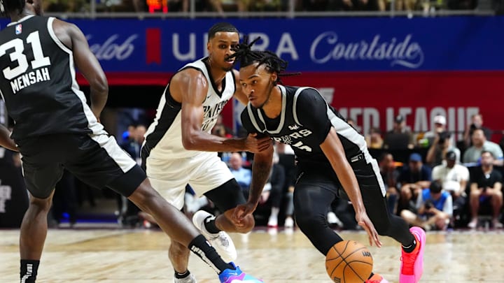 Jul 13, 2024; Las Vegas, NV, USA; San Antonio Spurs guard Stephon Castle (5) dribbles around Portland Trail Blazers forward Kris Murray (10) as San Antonio Spurs forward Nathan Mensah (31) sets a pick during the second quarter at Thomas & Mack Center. Mandatory Credit: Stephen R. Sylvanie-Imagn Images Jul 13, 2024; Las Vegas, NV, USA; San Antonio Spurs guard Stephon Castle (5) dribbles around Portland Trail Blazers forward Kris Murray (10) as San Antonio Spurs forward Nathan Mensah (31) sets a pick during the second quarter at Thomas & Mack Center. Mandatory Credit: Stephen R. Sylvanie-Imagn Images