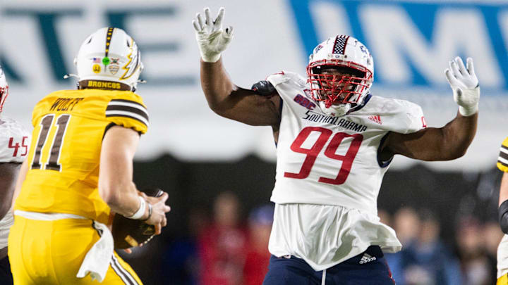 South Alabama Jaguars defensive lineman Wy'Kevious Thomas (99) pressures Western Michigan Broncos quarterback Hayden Wolff (11) as South Alabama takes on Western Michigan during the IS4S Salute to Veterans Bowl at Cramton Bowl in Montgomery, Ala., on Saturday, Dec. 14, 2024. South Alabama Jaguars lead Western Michigan Broncos 16-13 at halftime.