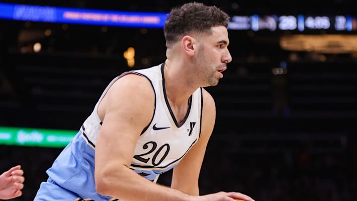 Mar 22, 2025; Atlanta, Georgia, USA; Atlanta Hawks forward Georges Niang (20) drives to the basket against the Golden State Warriors in the first quarter at State Farm Arena. Mandatory Credit: Brett Davis-Imagn Images