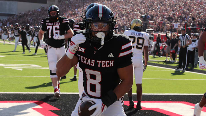 Texas Tech Red Raiders running back Cameron Dickey (8) reacts after scoring a touchdown against the Central Florida Knights in the first half at Jones AT&T Stadium.