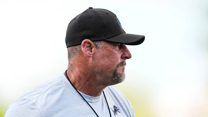 Detroit Lions head coach Dan Campbell watches practice during training camp 