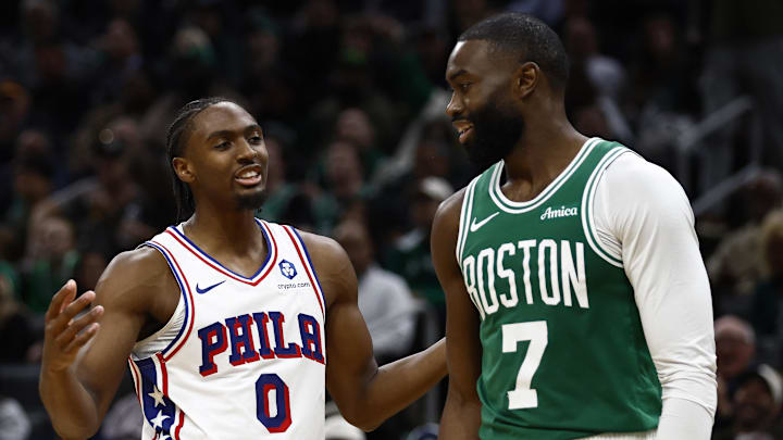 Oct 22, 2025; Boston, Massachusetts, USA; Philadelphia 76ers guard Tyrese Maxey (0) talks with Boston Celtics guard Jaylen Brown (7) during the second half at TD Garden. Mandatory Credit: Winslow Townson-Imagn Images