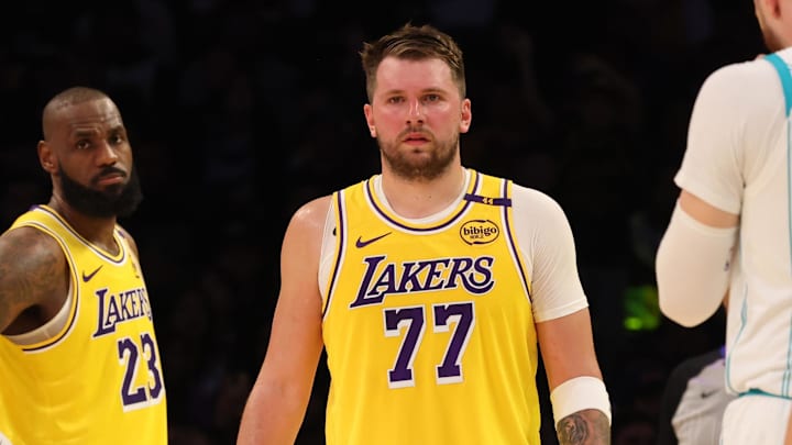 Feb 19, 2025; Los Angeles, California, USA; Los Angeles Lakers forward LeBron James (23) and guard Luka Doncic (77) during the second quarter against the Charlotte Hornets at Crypto.com Arena. Mandatory Credit: Jason Parkhurst-Imagn Images Feb 19, 2025; Los Angeles, California, USA; Los Angeles Lakers forward LeBron James (23) and guard Luka Doncic (77) during the second quarter against the Charlotte Hornets at Crypto.com Arena. Mandatory Credit: Jason Parkhurst-Imagn Images