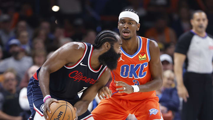 Nov 11, 2024; Oklahoma City, Oklahoma, USA; Oklahoma City Thunder guard Shai Gilgeous-Alexander (2) defends a drive by Los Angeles Clippers guard James Harden (1) during the second quarter at Paycom Center. Mandatory Credit: Alonzo Adams-Imagn Images Nov 11, 2024; Oklahoma City, Oklahoma, USA; Oklahoma City Thunder guard Shai Gilgeous-Alexander (2) defends a drive by Los Angeles Clippers guard James Harden (1) during the second quarter at Paycom Center. Mandatory Credit: Alonzo Adams-Imagn Images