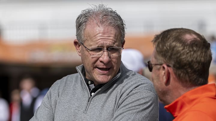 Florida State offensive coordinator Gus Malzahn talks with Auburn head coach Hugh Freeze