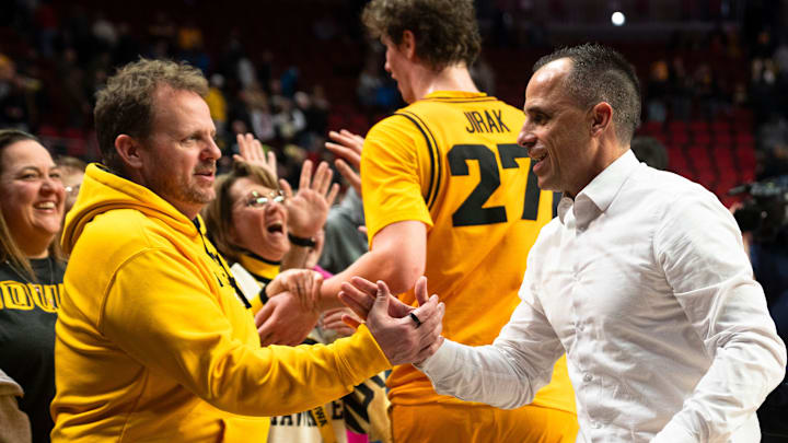 Iowa head coach Ben McCollum greets fans after a game at Casey's Center on Saturday, Dec. 20, 2025 in Des Moines.