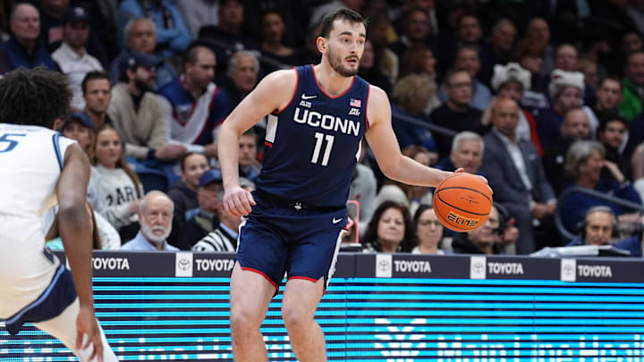 Jan 8, 2025; Villanova, Pennsylvania, USA; Connecticut Huskies forward Alex Karaban (11) controls the ball against the Villanova Wildcats in the first half at William B. Finneran Pavilion. Mandatory Credit: Kyle Ross-Imagn Images