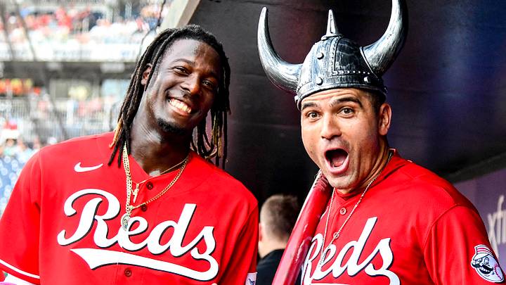 Cincinnati Reds first baseman Joey Votto (19) reacts with shortstop Elly De La Cruz (44)