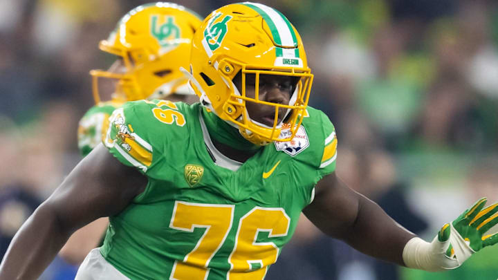 Jan 1, 2024; Glendale, AZ, USA; Oregon Ducks offensive lineman Josh Conerly Jr. (76) against the Liberty Flames during the 2024 Fiesta Bowl at State Farm Stadium. Mandatory Credit: Mark J. Rebilas-Imagn Images