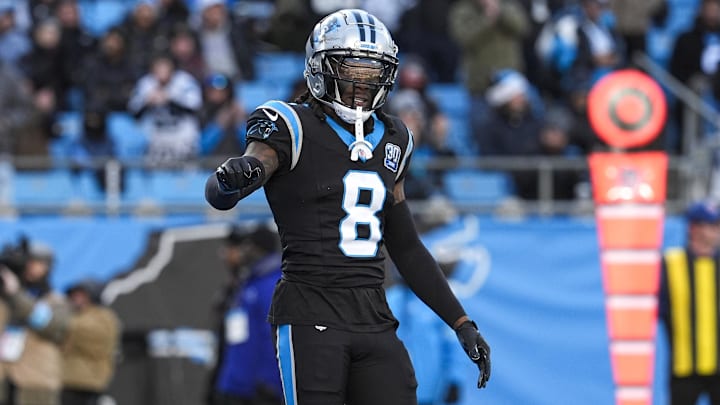 Dec 22, 2024; Charlotte, North Carolina, USA; Carolina Panthers cornerback Jaycee Horn (8) questions a call by the official  during the second half against the Arizona Cardinals at Bank of America Stadium. Mandatory Credit: Jim Dedmon-Imagn Images