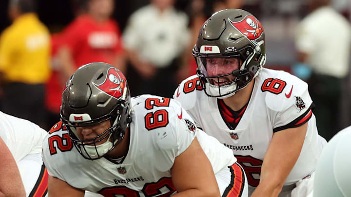Aug 23, 2024; Tampa, Florida, USA; Tampa Bay Buccaneers center Graham Barton (62) hikes the ball to Tampa Bay Buccaneer quarterback Baker Mayfield (6) against the Miami Dolphins during the first quarter at Raymond James Stadium. Mandatory Credit: Kim Klement Neitzel-Imagn Images Aug 23, 2024; Tampa, Florida, USA; Tampa Bay Buccaneers center Graham Barton (62) hikes the ball to Tampa Bay Buccaneer quarterback Baker Mayfield (6) against the Miami Dolphins during the first quarter at Raymond James Stadium. Mandatory Credit: Kim Klement Neitzel-Imagn Images