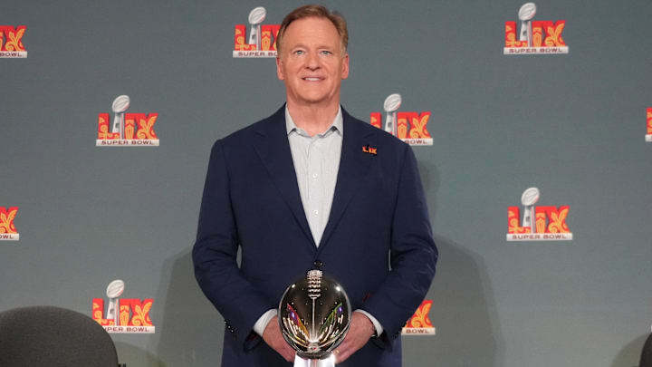 Feb 3, 2025; New Orleans, LA, USA; NFL commissioner Roger Goodell poses with Vince Lombardi trophy and Philadelphia Eagles and Kansas City Chiefs helmets at a press conference ahead of Super Bowl LIX at the Caesars Superdome. Mandatory Credit: Kirby Lee-Imagn Images
