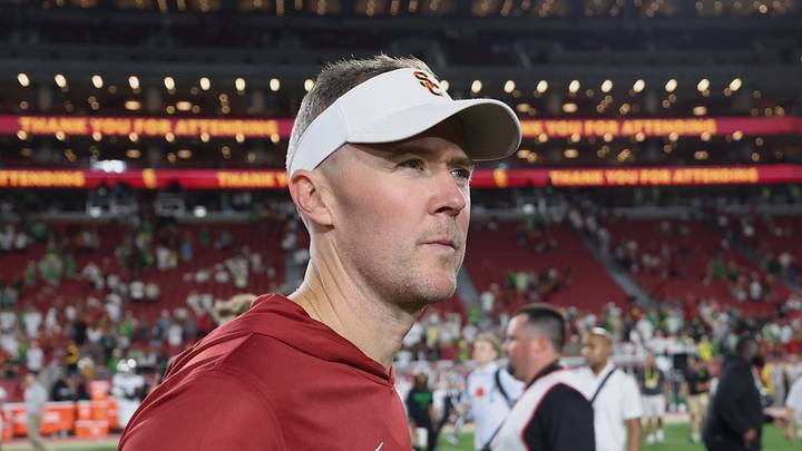 Sep 26, 2026; Los Angeles, California, USA;  USC Trojans head coach Lincoln Riley walks off the field after the game against the Oregon Ducks at United Airlines Field at Los Angeles Memorial Coliseum.  Mandatory Credit: Kiyoshi Mio-Imagn Images