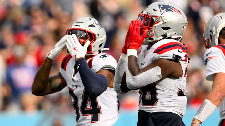 New England Patriots wide receiver Kendrick Bourne (84) celebrates the touchdown of running back Rhamondre Stevenson (38) against the Tennessee Titans during the second half at Nissan Stadium.