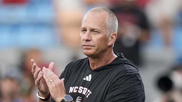 Sep 7, 2024; Charlotte, North Carolina, USA; North Carolina State Wolfpack head coach Dave Doeren during pregame activities against the Tennessee Volunteers at the Dukes Mayo Classic at Bank of America Stadium. Mandatory Credit: Jim Dedmon-Imagn Images Sep 7, 2024; Charlotte, North Carolina, USA; North Carolina State Wolfpack head coach Dave Doeren during pregame activities against the Tennessee Volunteers at the Dukes Mayo Classic at Bank of America Stadium. Mandatory Credit: Jim Dedmon-Imagn Images