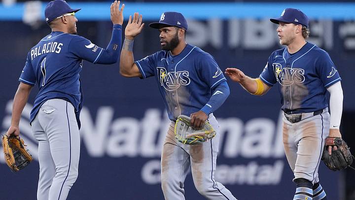 May 12, 2026; Toronto, Ontario, CAN; Tampa Bay Rays pinch hitter Richie Palacios (1) celebrates the win with center fielder Cedric Mullins (31) against the Toronto Blue Jays at the end of the tenth inning at Rogers Centre.