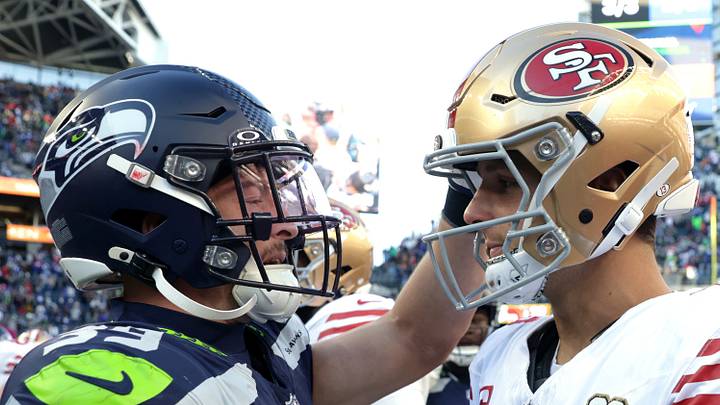 Seattle Seahawks safety Ty Okada greets San Francisco 49ers quarterback Brock Purdy. Seattle Seahawks safety Ty Okada greets San Francisco 49ers quarterback Brock Purdy.