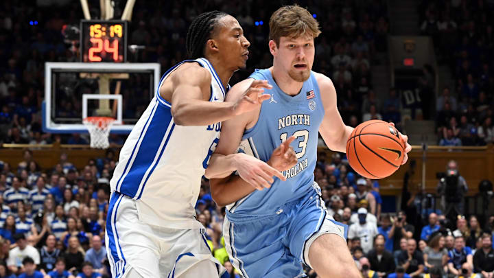 Mar 7, 2026; Durham, North Carolina, USA; North Carolina Tar Heels center Henri Veesaar (13) drives to the basket as Duke Blue Devils forward Maliq Brown (6) defends during the first half at Cameron Indoor Stadium. Mandatory Credit: Rob Kinnan-Imagn Images
